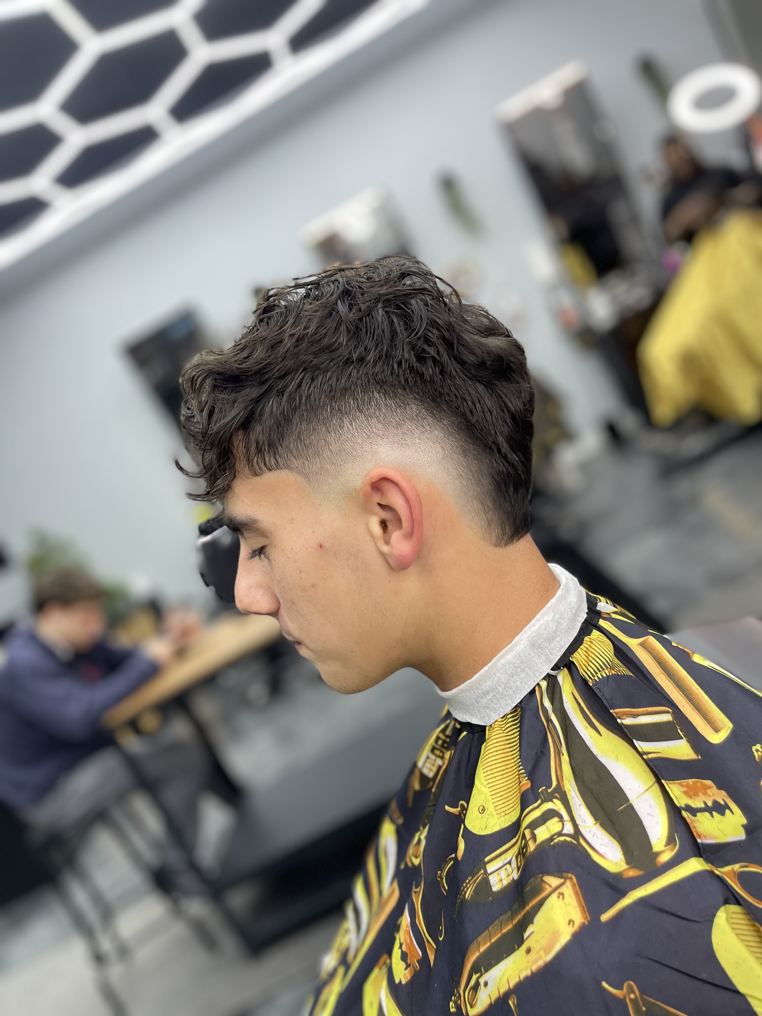 Low skin burst fade with textured crop